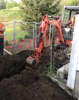 Using a mini-excavator to install deep utilities in Vernon BC