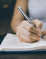 woman writing notes