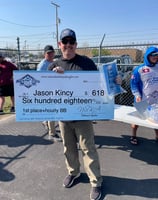 a man holding a large check checkered checkered checkered checkered checkered