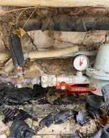 a pipe with a red valve and a pipe with a red valve