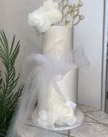 a cake with a white cake topperf and a cake topperf