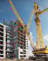 yellow crane under blue sky during daytime
