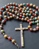 a necklace with pearls and a gold clasp