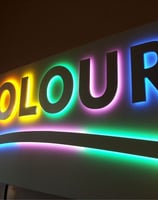 a sign that says colour in the middle of the sign