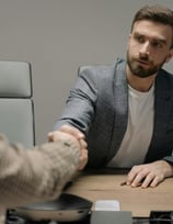 People are talking and shaking hands