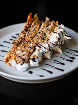 a dessert with chocolate and cream on a plate