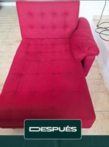 a red couch with a red couch and a black chair