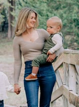 an adoption consultant woman holding a baby in her arms