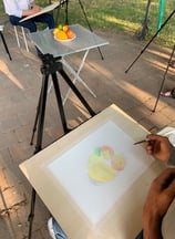 a man is painting a picture of a painting