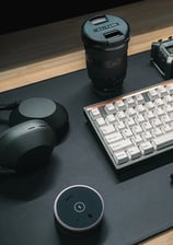 a keyboard and a laptop computer sitting on a desk