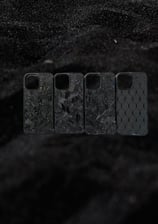a group of four cell phones with a black background