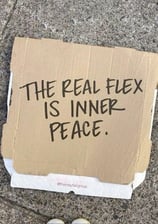 a cardboard box with a sign that says the real fix is inner peace peace peace