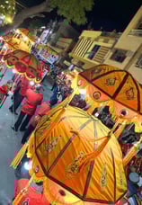 Gangaur roadshow featuring the Manohar Brass Band with a light show at night.