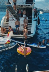 a group of people on a boat in the water