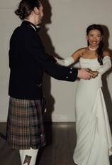 a man in a kiltrum kilt and a woman in a kilt