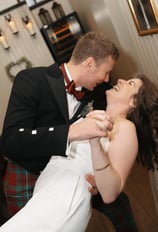 a groom and a bride are laughing naturally