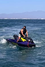 a man riding a jet ski in the ocean