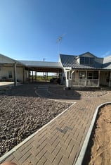 New roof with concrete porch and a custom paver walkway