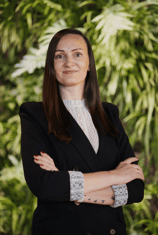 a woman in a black suit headshot