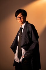 Headshot of a young Asian male model, cosplaying some Harry Potter character