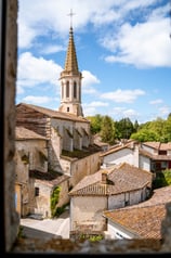 a church steeple with a steeple tower in the background