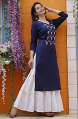 A fusion favorite, skirt-kurta combos are ideal for festivals and weddings. The long flared skirt ad