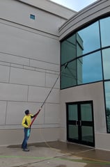 Cleaning windows of a commercial business with a five stage filtration water pool 