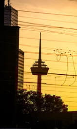 a tower with a tower in the background