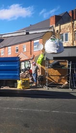 blue pick up truck with extended grabber in birmingham