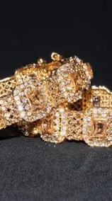 a pair of gold filled with diamonds and a gold bracelet