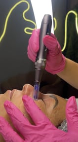a woman getting a facial lift in a beauty salon