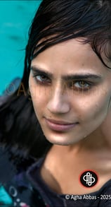 close-up of a beautiful , green eyed, dark hair, sexy young girl in a swimming.  pool, 