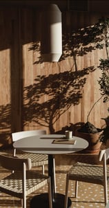Peaceful clinic outdoor space with sunlight and shadows – a calming environment for care.
