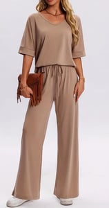 a woman in a brown top and pants