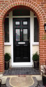 a black front door 2 panel 2 square glass with side panels