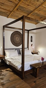 King bed with forest view at ilika Resorts, Uttarakhand