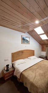 Deluxe Family Type Room In Manali with Traditional Wooden Finishing