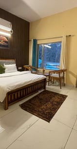 a luxury bedroom with a bed and a television