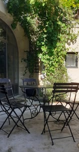 a patio table with chairs and a table