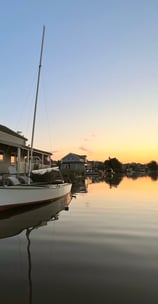 a boat on the water at sunset. Zuytland-Buiten Simonshaven, Zuid-Holland
