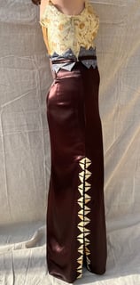 A gold brocade and brown satin evening gown
