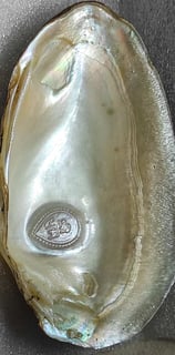 "11mm white designer cultured pearl with a divine face motif–crafted using nucleus technique-for global buyers"