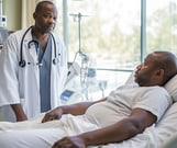 a doctor and patient in a hospital room
