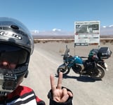 a man in a helmet and helmet on a motorcycle