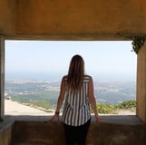 Martina looking at the view from a hilltop in Cascais, Portugal.