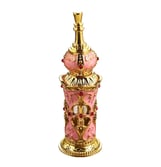 a pink and gold arab perfume bottle