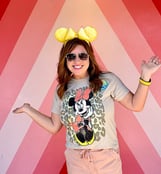 Karen Amundson in front of the "Future World" photo wall at EPCOT®.