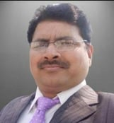 a man in a suit and tie with a purple tie
