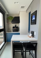 a kitchen with a table and chairs and a window