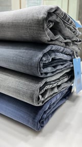 a stack of folded jeans